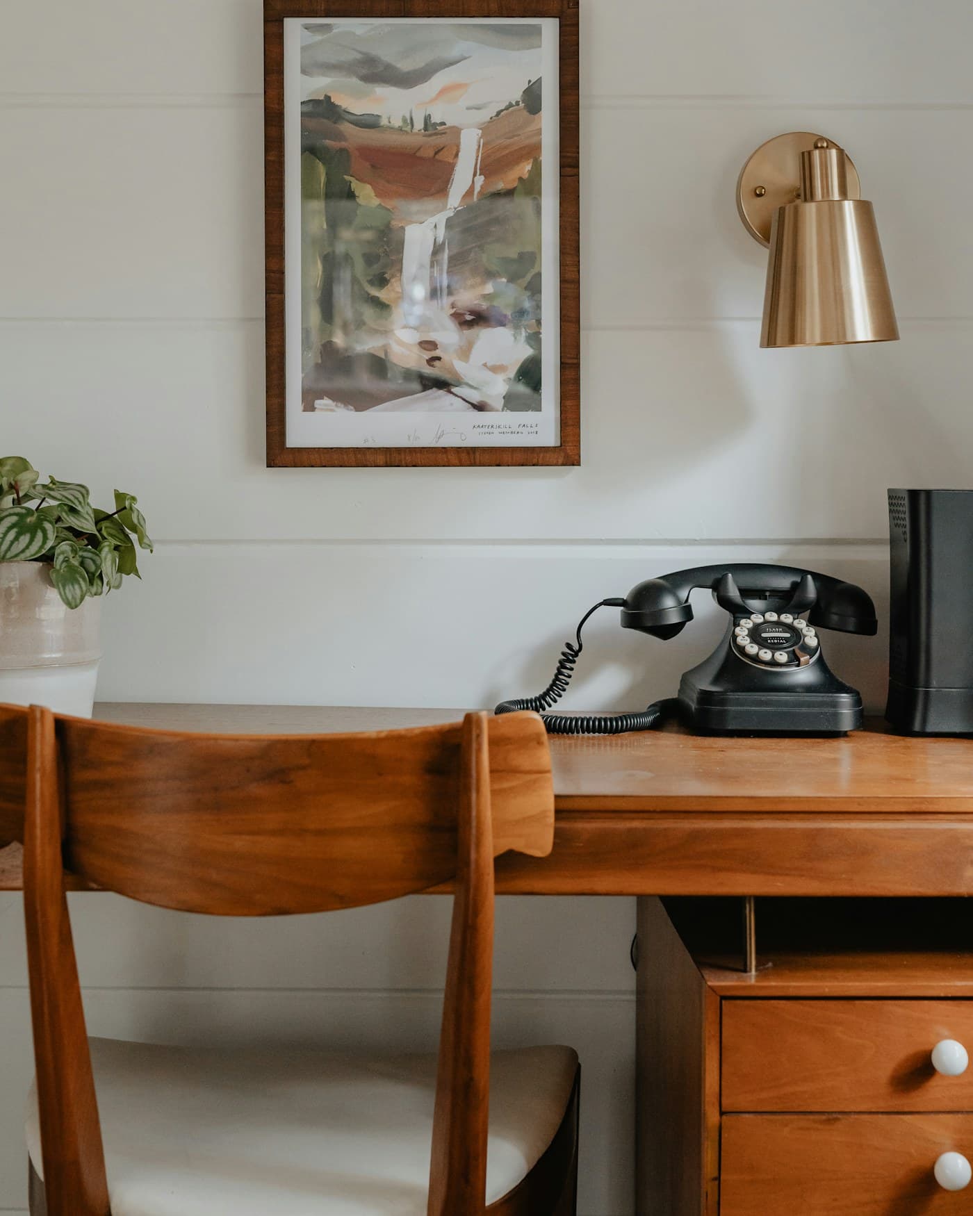 A beautiful, practical home workspace with a desk, chair and warm natural light.